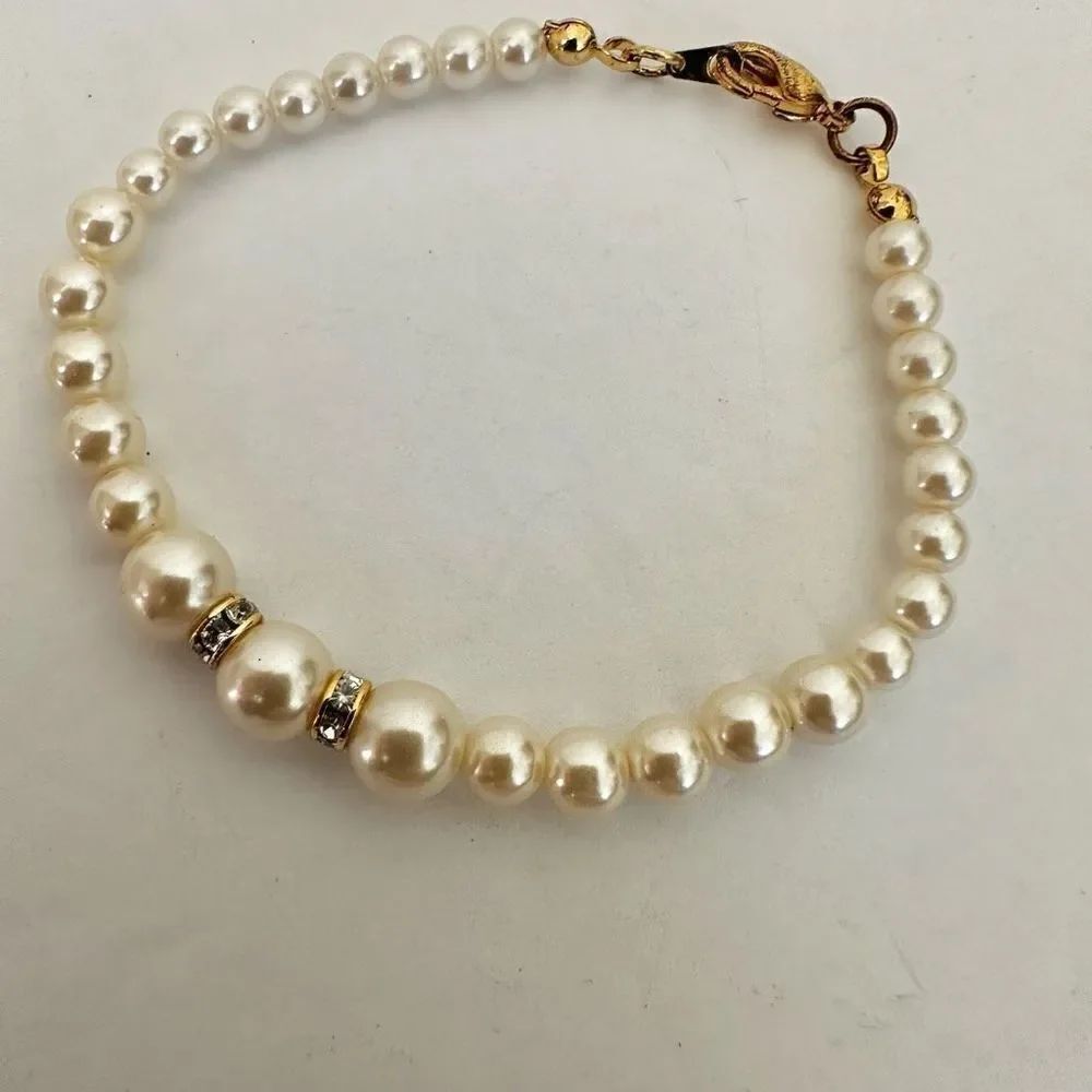 Faux pearl gold tone rhinestone bracelet